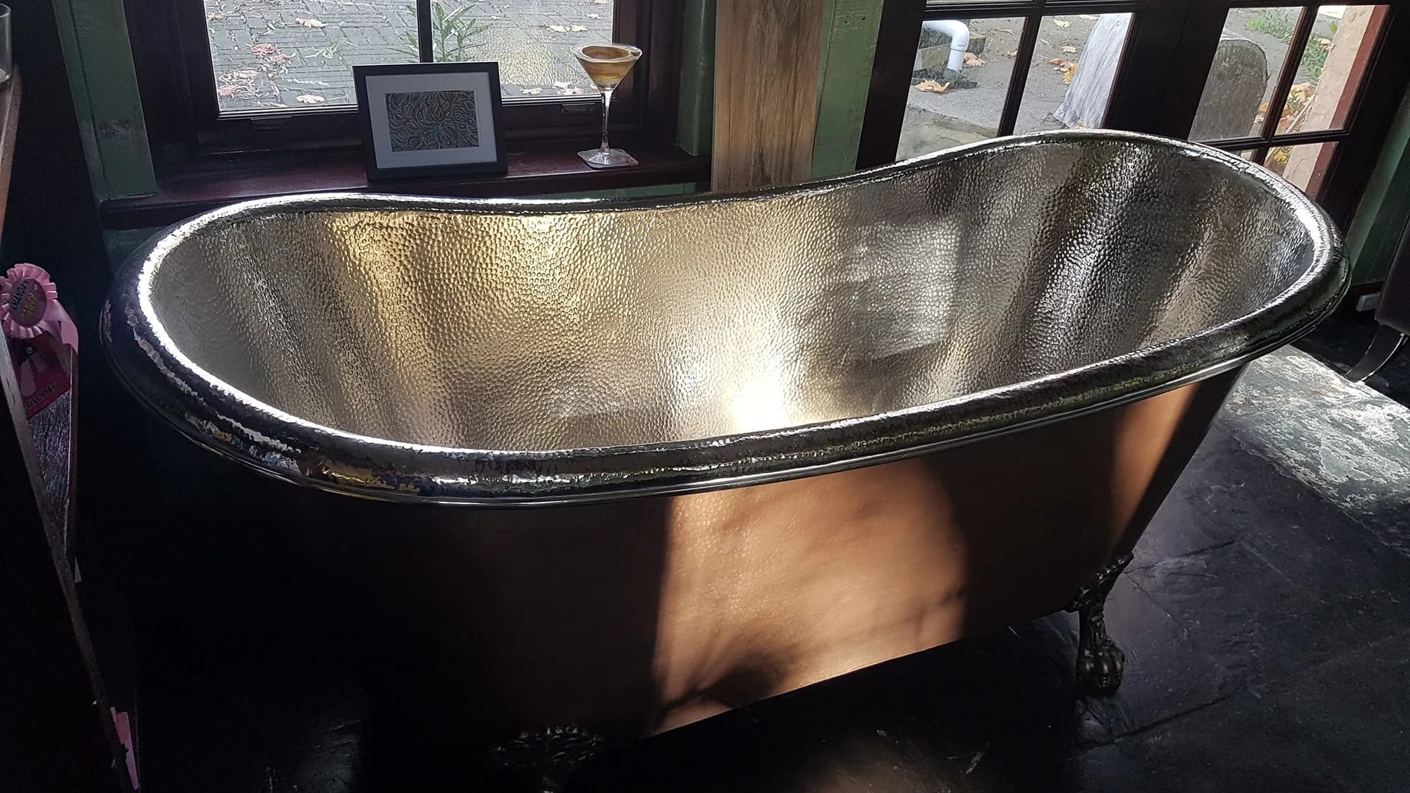 Freestanding hammered nickel slipper bathtub, a statement All Style Bathrooms install